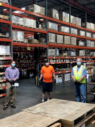 Bolts & Nuts CEO Keith Shope, left with two other members of the company's team in its Chattanooga, TN headquarters warehouse.