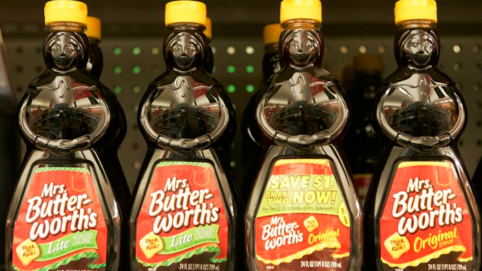 In this Nov. 20, 2007 file photo, bottles of Mrs. Butterworth's syrup are displayed on a supermarket shelf in Basking Ridge, N.J. Mrs. Butterworth and Cream of Wheat are the latest brands reckoning with racially charged logos. Chicago-based Conagra Brands, which makes Mrs. Butterworth’s syrup, said its female-shaped bottles are intended to evoke a “loving grandmother.” But the company said it can understand that the packaging could be misinterpreted. The soul-searching comes in the wake of PepsiCo's announcement Wednesday, June 17, 2020, that it's renaming its Aunt Jemima syrup brand.