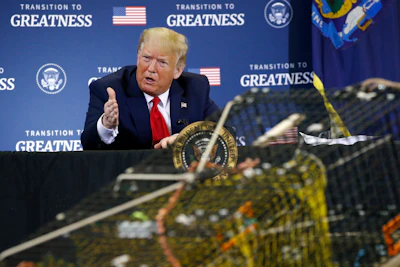 President Donald Trump speaks during a roundtable discussion with commercial fishermen at Bangor International Airport in Bangor, Maine on Friday, June 5.