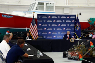 President Donald Trump speaks during a roundtable discussion with commercial fishermen at Bangor International Airport in Bangor, Maine on Friday, June 5.