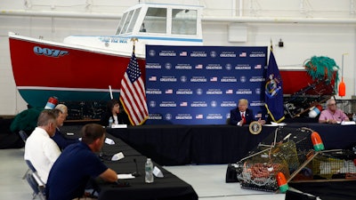 President Donald Trump speaks during a roundtable discussion with commercial fishermen at Bangor International Airport in Bangor, Maine on Friday, June 5.