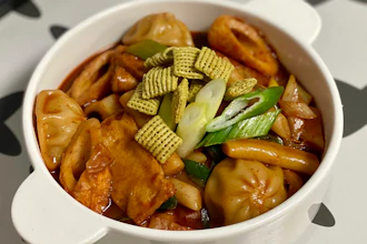 In this July 3 photo, provided by Lee Hyun Su, pieces of new green onion flavored Chex cereal are sprinkled on a bowl of Tteok-bokki, or stir-fried rice cakes, a popular Korean dish in Seoul, South Korea. The cereal has become a sensation in South Korea after 16 years of delay in its release.