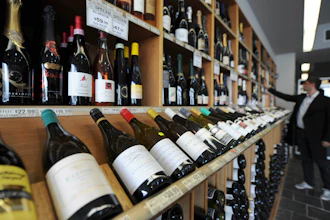 In this 2012 file photo, a shopper looks over the wine at King & Godfree, one of Australia's oldest licensed grocery stores in, Melbourne, Australia.