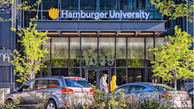 People walk past the front entrance to Hamburger University, McDonald's Headquarters located on the Near West Side of Chicago.