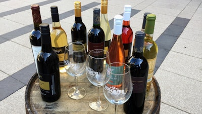 In the March 28, 2017 file photo, wines from the Next Chapter Winery, of New Prague, MN and Alexis Bailly Vineyard, of Hastings, MN are displayed at a news conference outside the federal courthouse in Minneapolis.