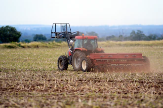 In this May 21, 2013 photo, a dairy farmer sows barley on his property on the Darling Downs in Brisbane, Australia.