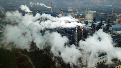 Smoke and steam rise from a coal processing plant in Hejin in central China's Shanxi Province.