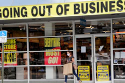 In this Aug. 6, 2020, file photo, a customer leaves a Pier 1 retail store, which is going out of business, during the coronavirus pandemic in Coral Gables, Fla. The Labor Department reported unemployment numbers Thursday, Sept. 3.
