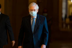 Senate Majority Leader Sen. Mitch McConnell of Ky. walks towards the Senate floor on Capitol Hill on Oct. 1 in Washington.