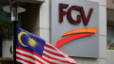 A Malaysian national flag is on display outside FGV Holdings Berhad, one of Malaysia's largest palm oil companies, in Kuala Lumpur on Thursday, Oct. 1.