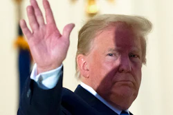 President Donald Trump waves.