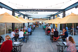 This photo provided by Adam M. Rammel shows the beer garden at The Syndicate on Aug. 20, 2020 in Bellefontaine, Ohio.