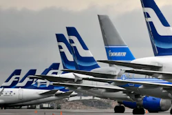 In this Nov. 16, 2009 file photo, passenger planes of the Finnish national airline company Finnair stand on the tarmac at Helsinki international airport, Helsinki.