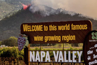In this Sept. 27 file photo, an air tanker drops retardant on the Glass Fire burning in Calistoga, CA
