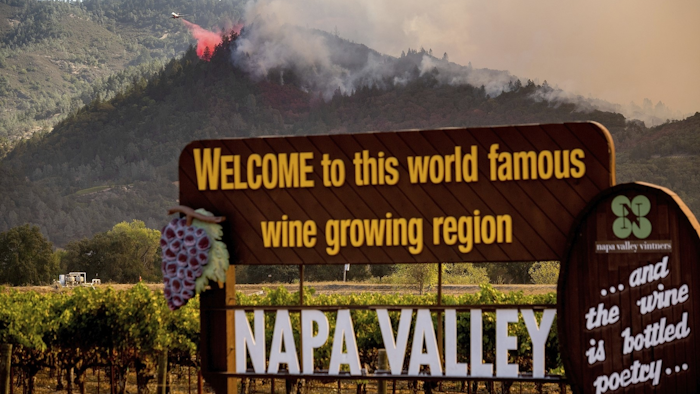 In this Sept. 27 file photo, an air tanker drops retardant on the Glass Fire burning in Calistoga, CA