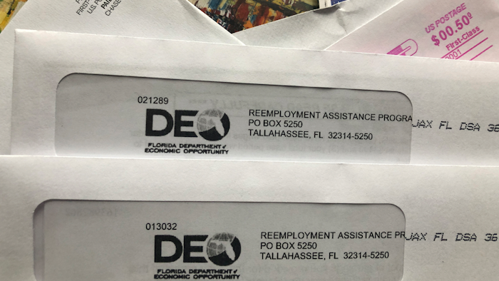 Envelopes from the Florida Department of Economic Opportunity Reemployment Assistance Program are shown in this photo from Nov. 5 in Surfside, FL.