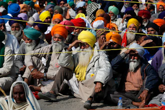 Indian farmers hold a meeting at the Delhi-Haryana state border in India on Sunday, Nov. 29.