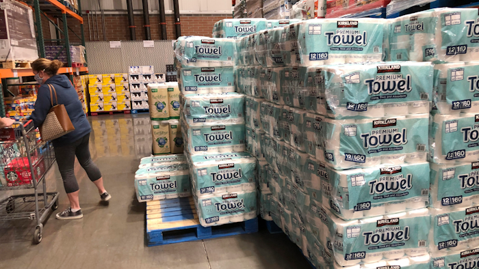 A shopper loads her basket next to a display of paper towels in a Costco warehouse in this photograph taken on Nov. 18 in Sheridan, CO.