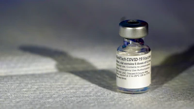 A vial of Pfizer's COVID-19 vaccine that received emergency use authorization is seen at George Washington University Hospital on Monday, Dec. 14 in Washington.