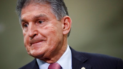 Sen. Joe Manchin, D-W.Va., speaks with reporters on Capitol Hill in Washington, Feb. 5, 2020.