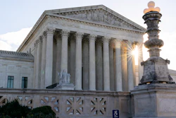 In this Nov. 10 photo, the sun rises behind the U.S. Supreme Court in Washington.