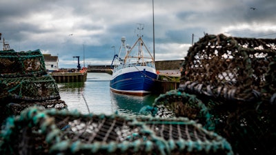 In this Jan. 28 file photo, a fishing vessel is docked at Kilkeel harbor in Northern Ireland.