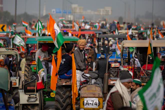 In this Jan. 7, 2021 photo, farmers take out a tractor rally in a protest against new farm laws at Ghaziabad, outskirts of New Delhi, India.