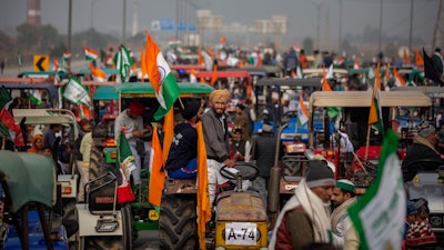 In this Jan. 7, 2021 photo, farmers take out a tractor rally in a protest against new farm laws at Ghaziabad, outskirts of New Delhi, India.