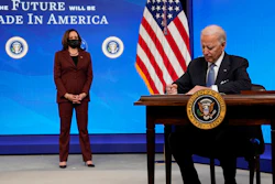 President Joe Biden signs an executive order on American manufacturing, in the South Court Auditorium on the White House complex on Monday, Jan. 25 in Washington.