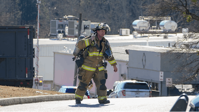 A Hall County firefighter leaves following a liquid nitrogen leak that killed six people at Prime Pak Foods, a poultry plant on Thursday, Jan. 28 in Gainesville, GA.