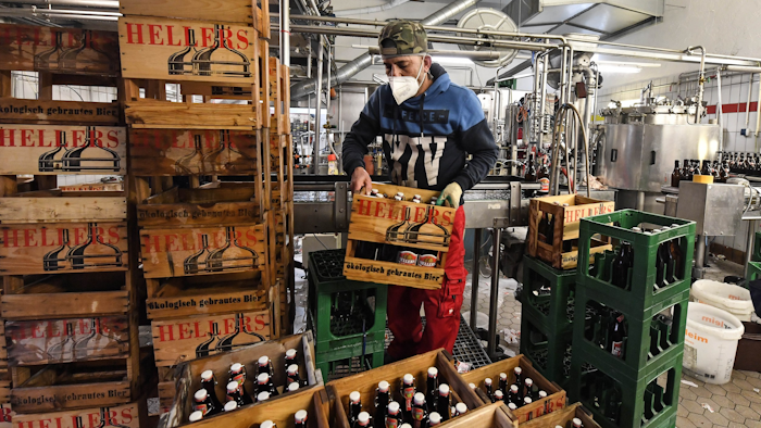 Employees work in the small family-run Heller brewery in Cologne, Germany on Feb. 9.