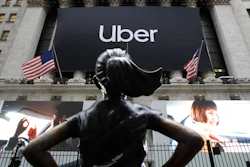 In this May 10, 2019 file photo, the statue of 'The Fearless Girl' in front of the New York Stock Exchange before Uber, the world's largest ride-hailing service, holds its initial public offering.