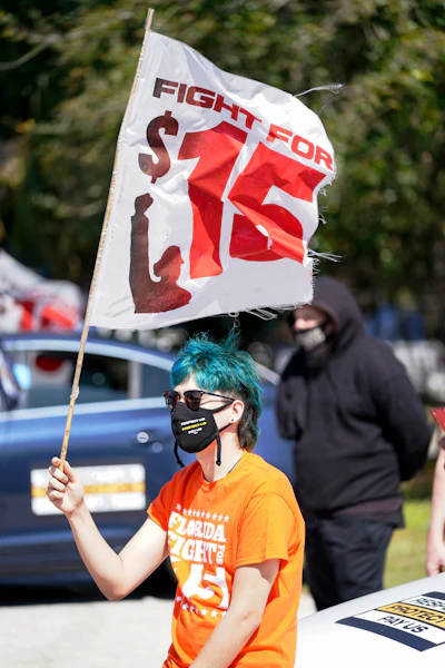 Cristian Cardona, an employee at a McDonald's, attends a rally for a $15 an hour minimum wage on Feb. 16 in Orlando, FL.