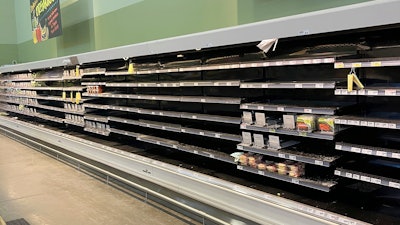 This photo provided by Rodney Giles shows empty shelves at an H-E-B grocery store on Feb. 17 at an H-E-B grocery store near Woodlands, TX.