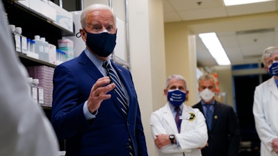 President Joe Biden speaks during a visit to the Viral Pathogenesis Laboratory at the National Institutes of Health.