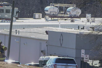 A Hall County firefighter leaves following a liquid nitrogen leak that killed six people at Prime Pak Foods, a poultry plant, on Jan. 28 in Gainesville, GA.