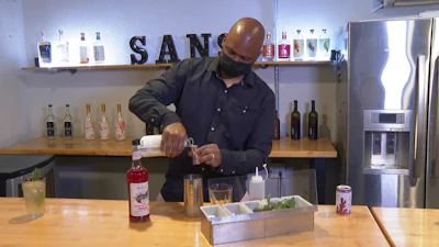 In this March 5 photo, owner Chris Marshall prepares an alcohol-free cocktail at San Bars in Austin, Texas.