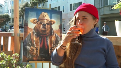 In this Feb. 12 photo, a customer drinks an alcohol-free cocktail at San Francisco's zero-proof bar Ocean Beach Cafe.