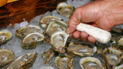 In this Aug. 13, 2013 file photo, oysters are displayed in Apalachicola, Fla.