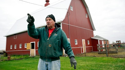 Morey Hill speaks about his farming operation on April 16 near Madrid, Iowa.