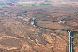 In this Oct. 8, 2019 photo, the Central Arizona Project canal runs through rural desert near Phoenix.