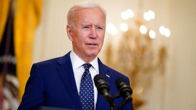 In this April 15, 2021, file photo, President Joe Biden speaks in the East Room of the White House in Washington. No nation offers asylum or other protections to people displaced because of climate change. Biden’s administration is studying the idea, and climate migration is expected to be discussed at his first climate summit.