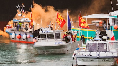 French fishermen angry over loss of access to waters off their coast gathered their boats in protest off the English Channel island of Jersey on Thursday, May 6.