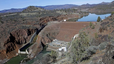 In this March 3, 2020, file photo, is the Iron Gate Dam, powerhouse and spillway are on the lower Klamath River near Hornbrook, Calif.
