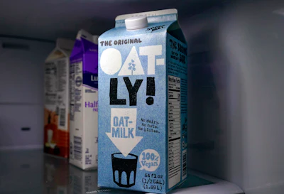 A carton of Oatly oat milk sits in a home refrigerator on May 18 in Bellingham, Wash.