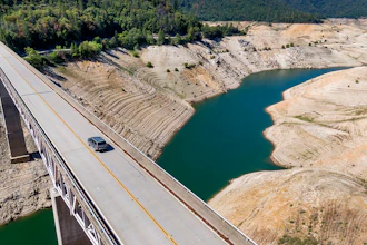 A home destroyed in the 2020 North Complex Fire sits above Lake Oroville on Sunday, May 23, 2021, in Oroville, CA. At the time of this photo, the reservoir was at 39 percent of capacity and 46 percent of its historical average.