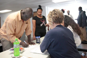 Employees of a Smithfield pork processing plant register to vote on June 3 on a contract offer from the company at the union's office in Sioux Falls, S.D. The union voted overwhelmingly against it, escalating labor negotiations.