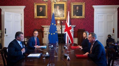 Britain's Minister for the Cabinet Office of the United Kingdom, David Frost, right, speaks to his EU counterpart Maros Sefcovic, during a meeting, in London on June 9.
