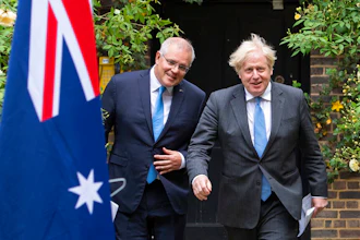 Britain's Prime Minister Boris Johnson, right, walks with Australian Prime Minister Scott Morrison after their meeting, in the garden of 10 Downing Streeet, in London on Tuesday June 15.