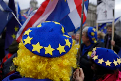 In this file photo dated Jan. 8, 2020, pro-Europe protesters demonstrate against Britain's Brexit split from the Bloc, outside the Houses of Parliament in London.